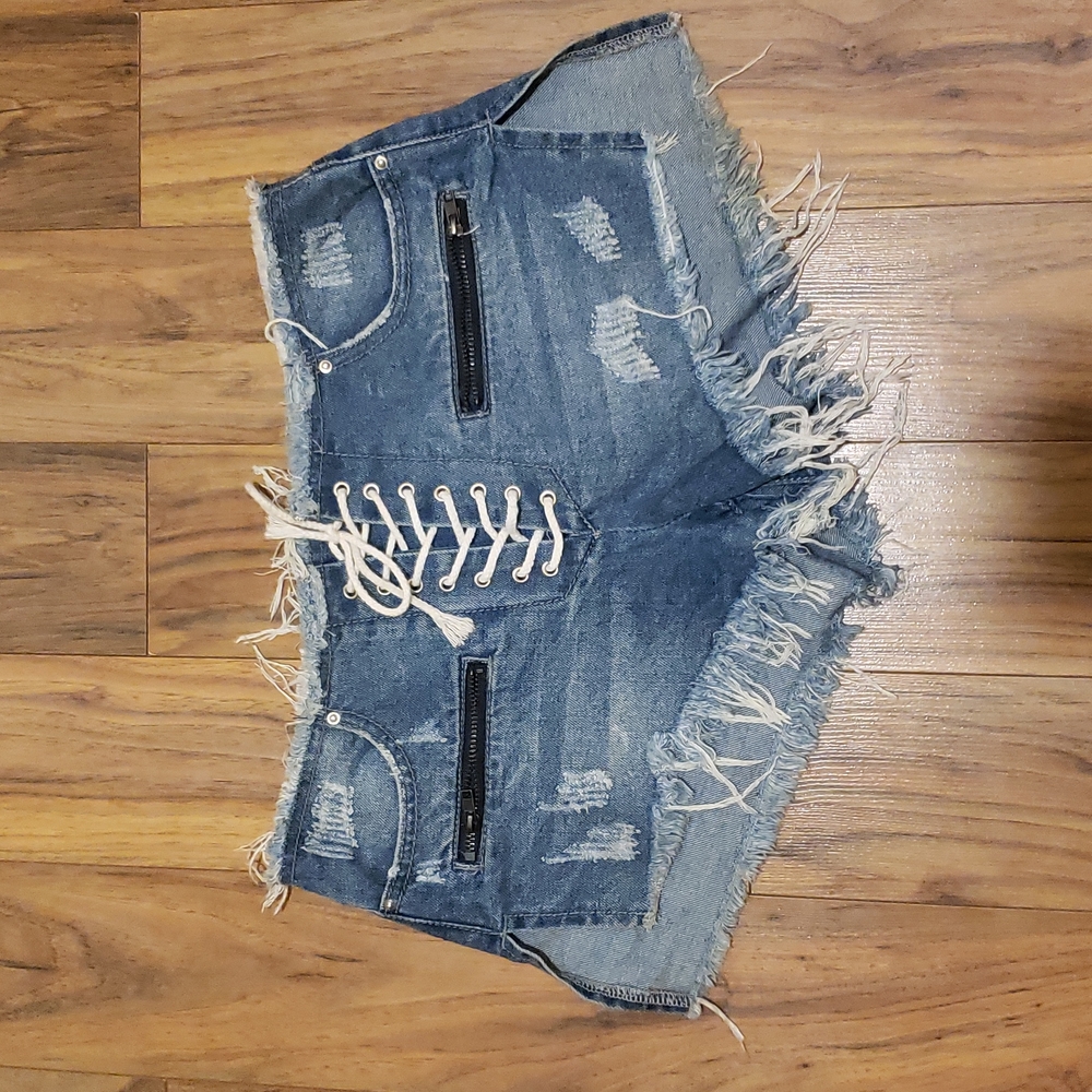 Distressed lace up denim shorts